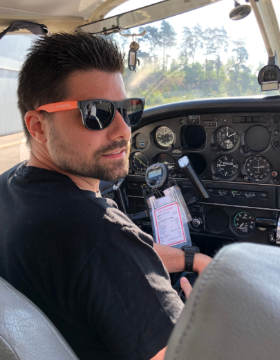 Andrew in a small plane cockpit